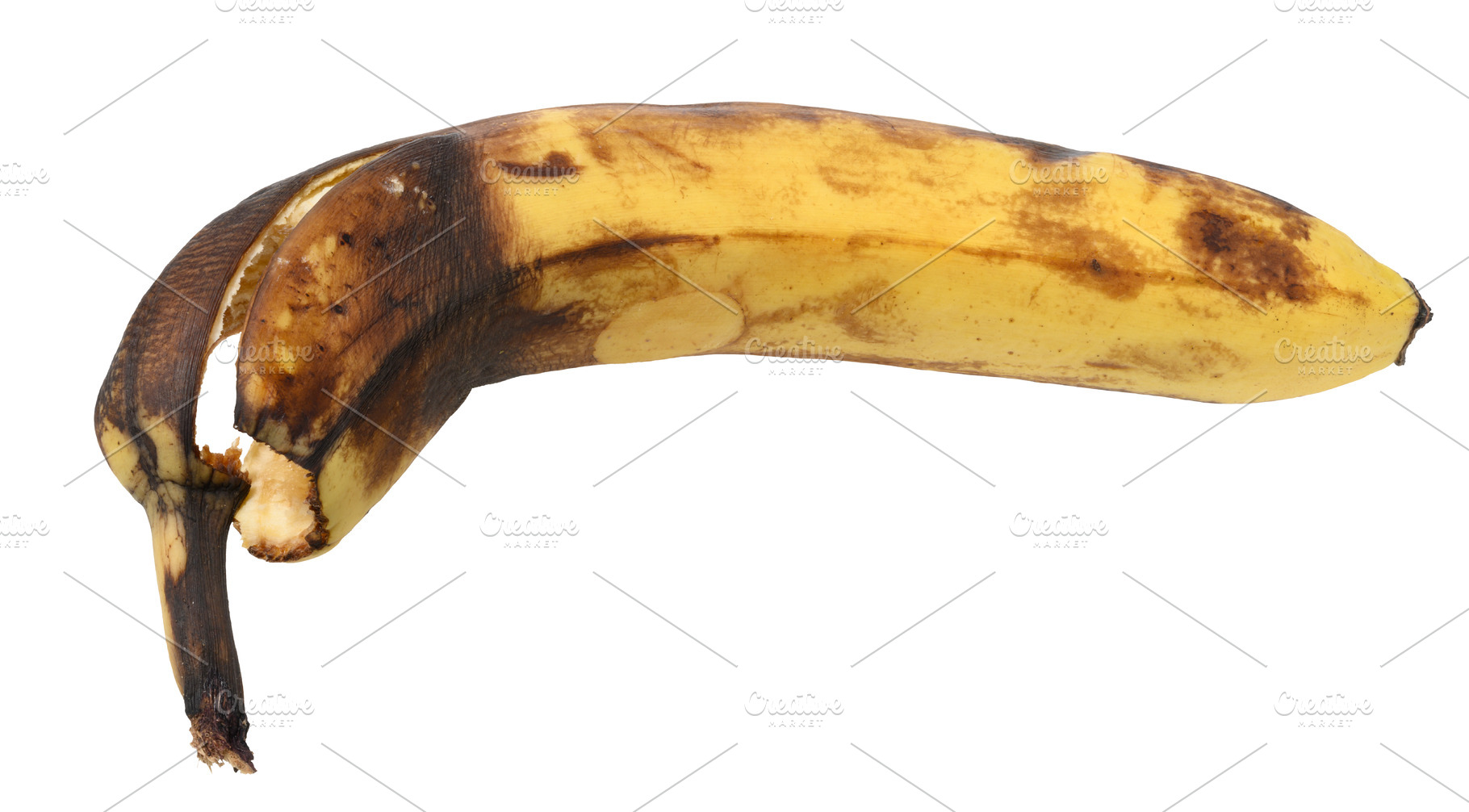 Rotten banana on isolated background, close up, a Food & Drink Photo by ndanko