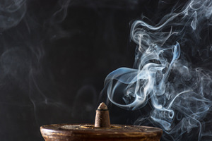 Various incenses on black background containing abstract, aroma, and