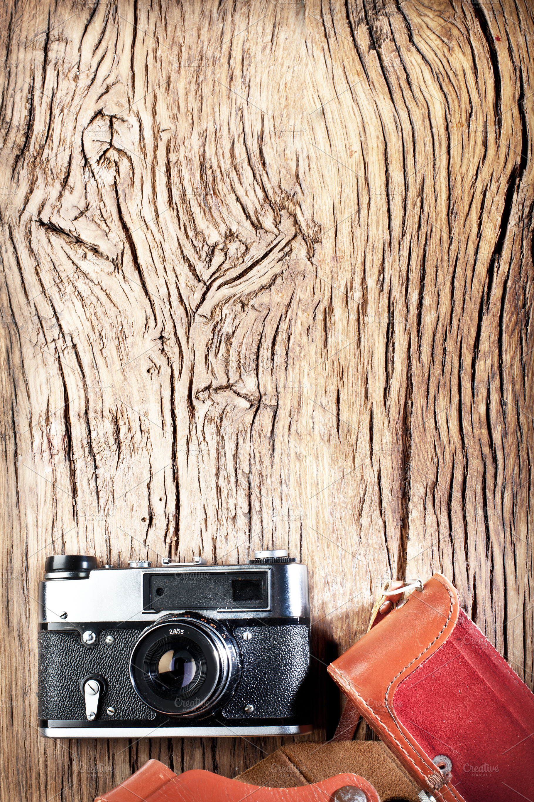Old rangefinder camera on the old wooden table., a Background Photo by Volff