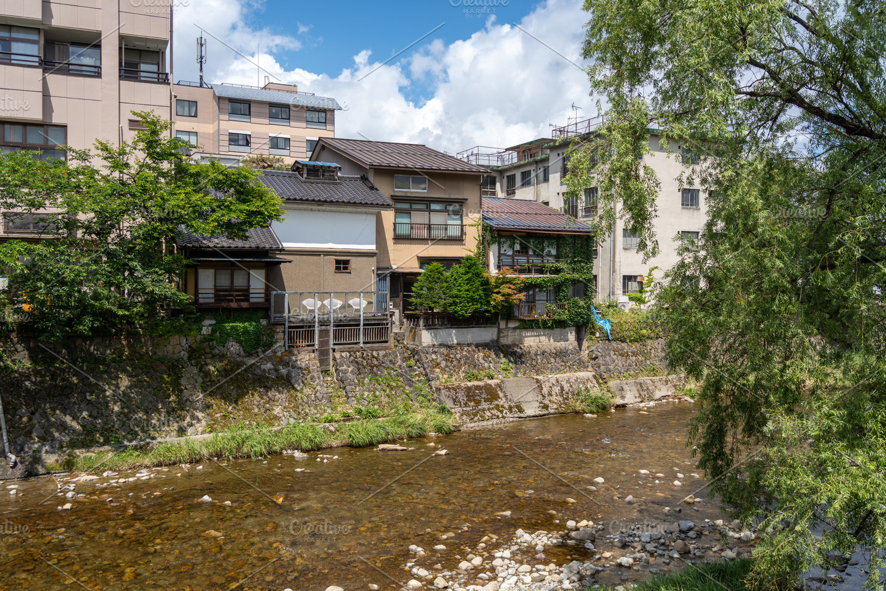 Traditional riverside houses along the Miyagawa River in Takayam, a Nature Photo by GoodGoods