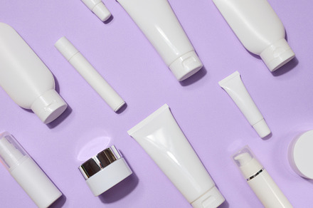 A variety of white plastic tubes and bottles with cosmetics arra