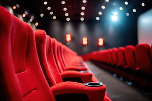 Modern red reclining seats with cup holders, an Arts & Entertainment Photo by AlyaAnd