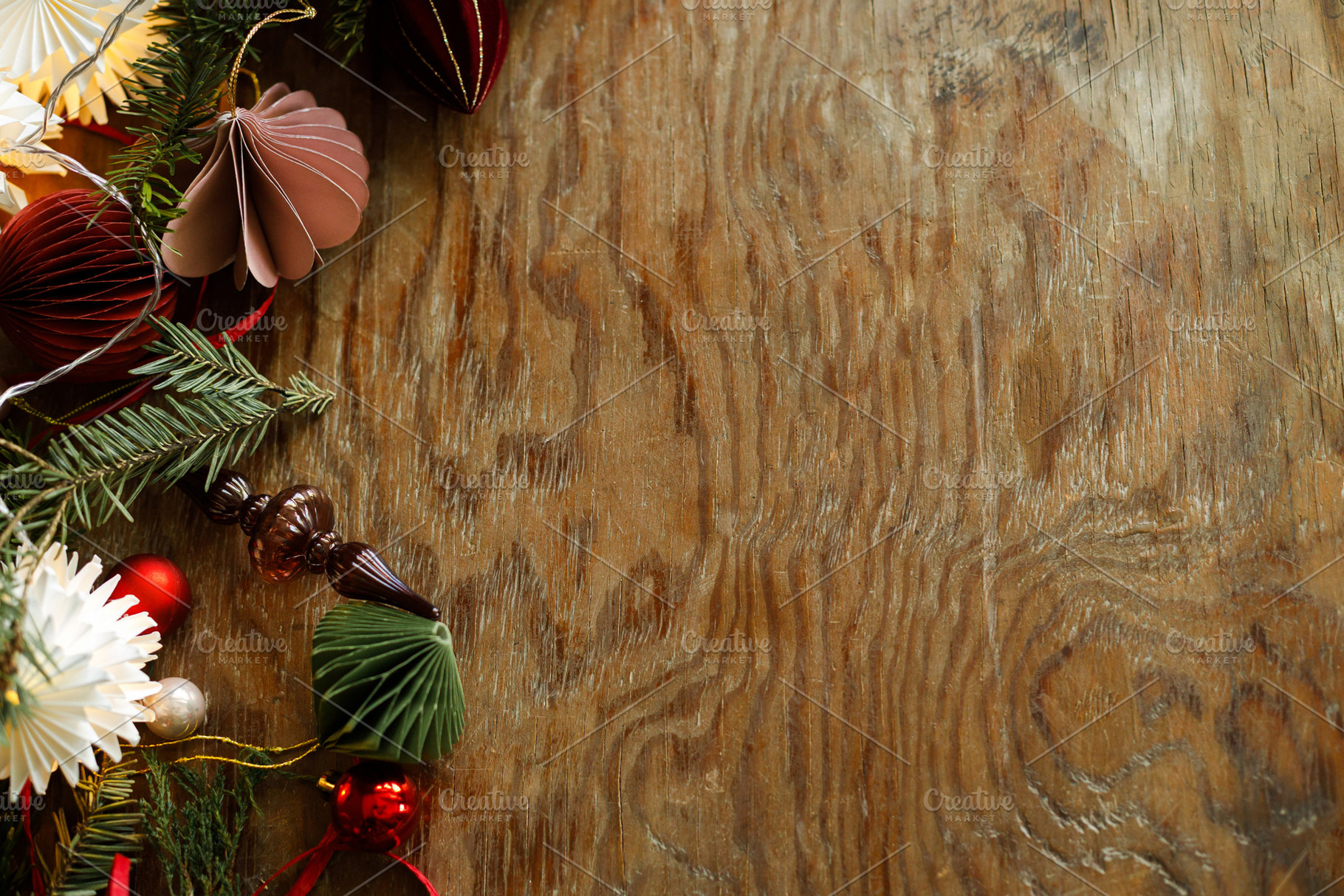 Christmas border. Festive side border of paper ornaments, glass, a Photo by Sonjachni