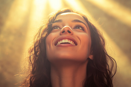 Woman in Awe Under Radiant Sunlight