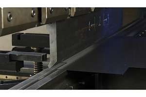 A metal sheet placed on a machine