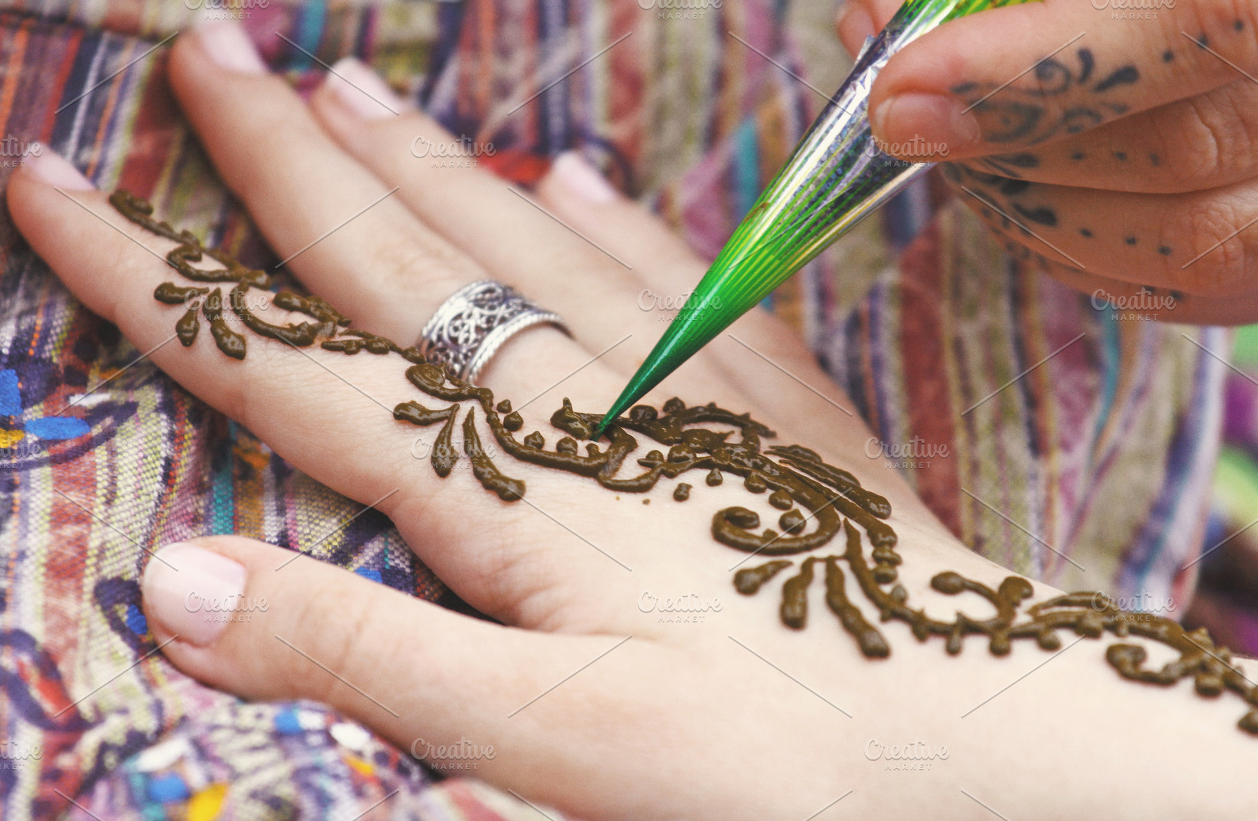 Henna tattoo on womans hand, a Beauty & Fashion Photo by BOOCYS