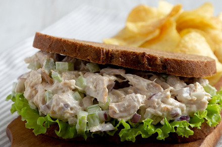 Homemade Chicken Salad Sandwich with Potato Chips, side view., a Food & Drink Photo by LiudmylaChuhunova