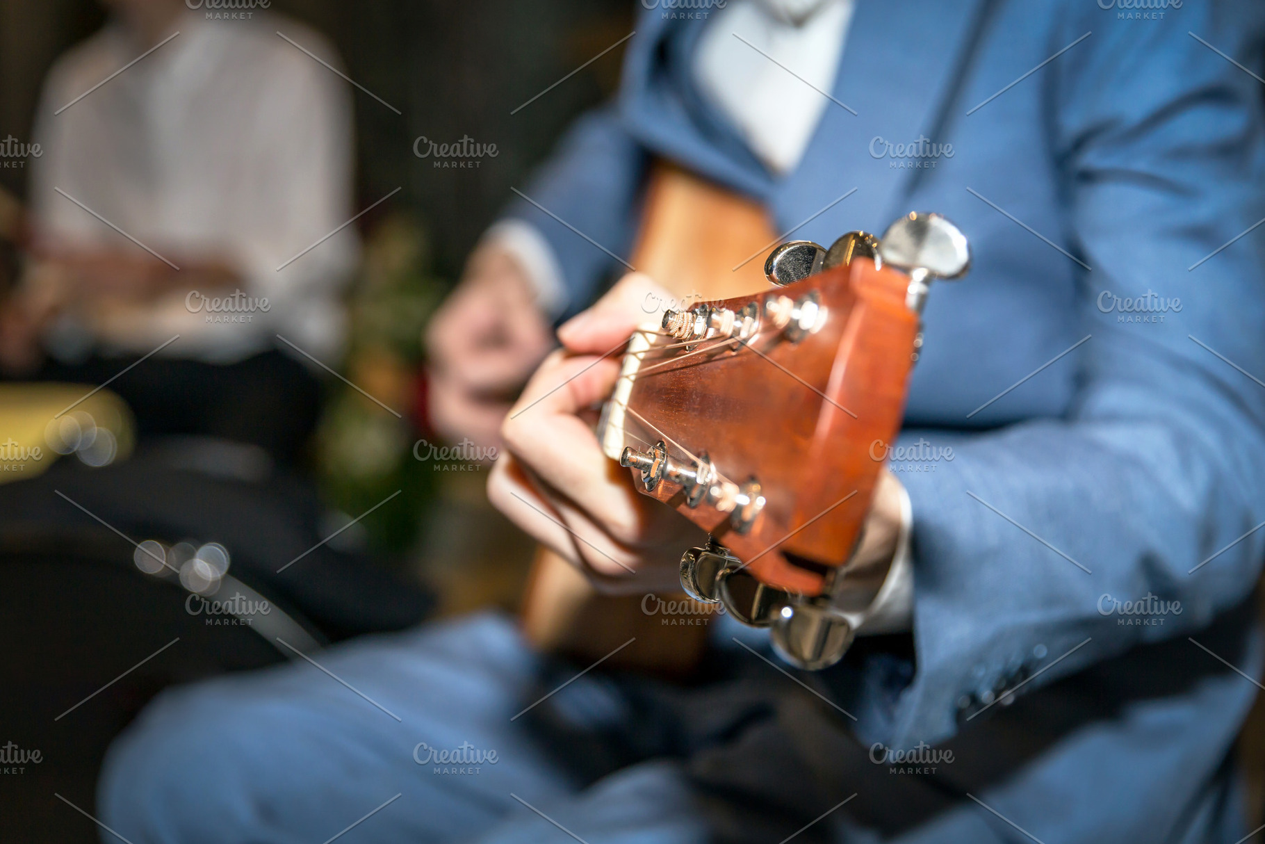 Acoustic guitar playing, an Arts & Entertainment Photo by KYNA STUDIO