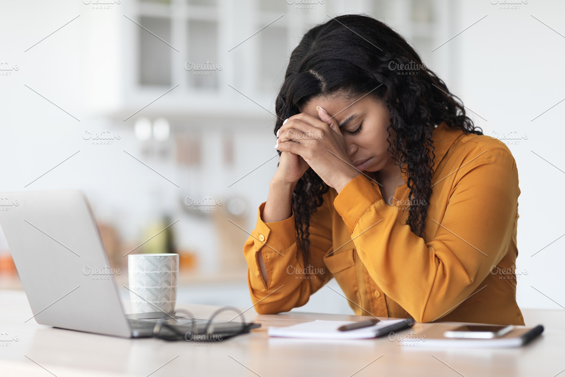 Tired african american lady experiencing burnout, working online, a Photo by Prostock-Studio
