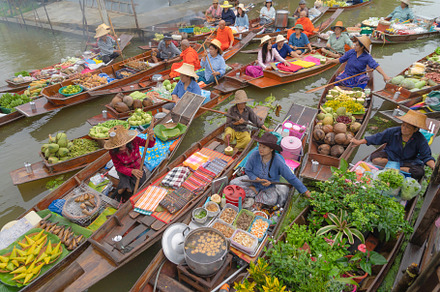 Damnoen saduak floating market or am stock photo containing floating and water, a Person Photo by Tampatra