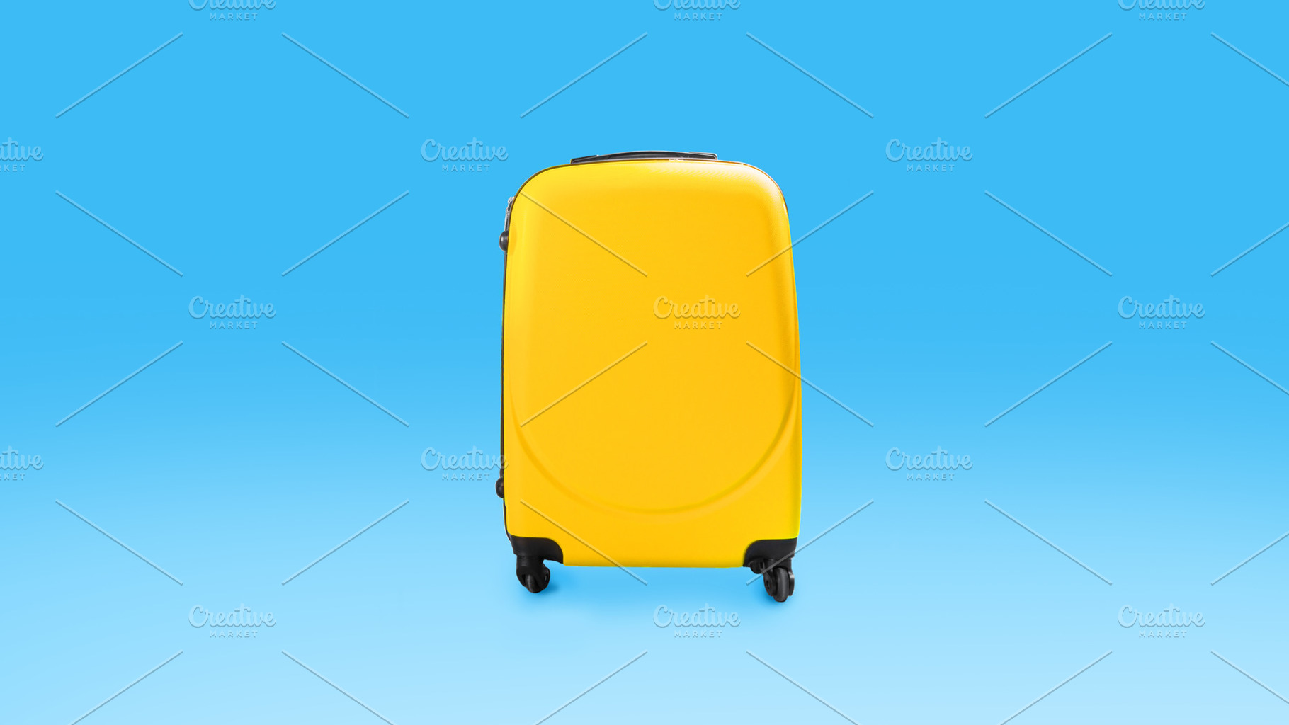 Yellow stylish suitcase isolated over blue studio background wall, a Photo by Prostock-Studio
