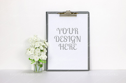 Clipboard mockup with white flowers, a Background Photo by Bubert Art