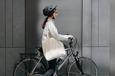 Woman holding eco bag or cotton tote