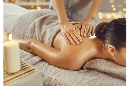 Young woman getting shoulder massage, a Beauty & Fashion Photo by StudioRomantic