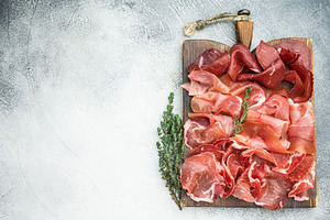 Italian charcuterie with prosciutto, coppa and bresaola arranged, a Food & Drink Photo by composter-box@mail.ru