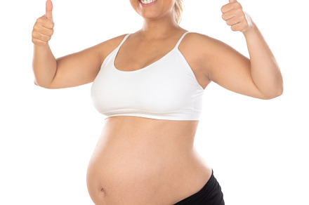 Image of pregnant woman touching her belly with hands, a Person Photo by José Manuel Gelpi