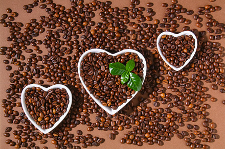 Roasted brown coffee beans on a brown background., a Food & Drink Photo by Detriana