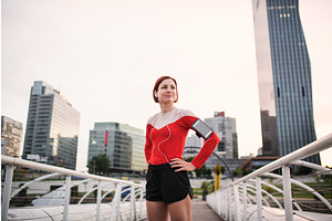 Young woman with smartphone standing, a Graphic by HalfPoint