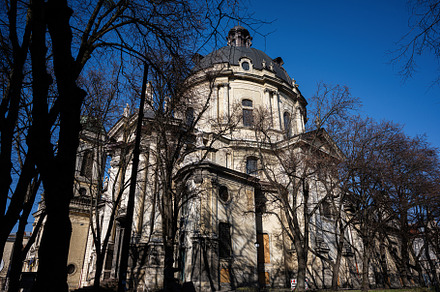 Historic Dominican Church and Monastery building seen through tr, a Photo by AS photostudio