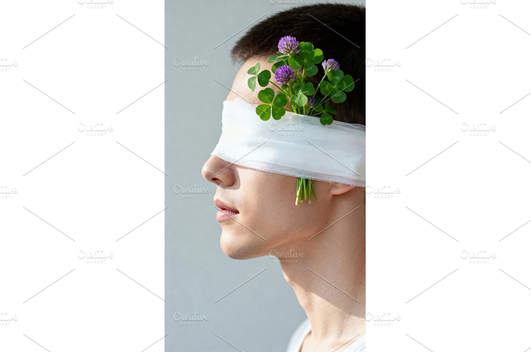 Man blindfolded with clover flowers, a Nature Photo by tilialucida