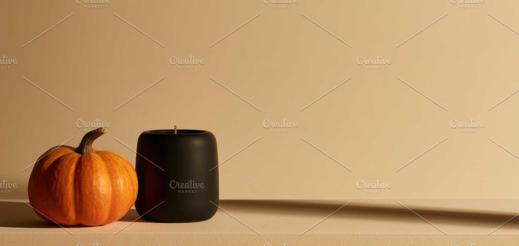 Minimal Halloween pumpkin and black candle with copy space, a Person Photo by José Manuel Gelpi