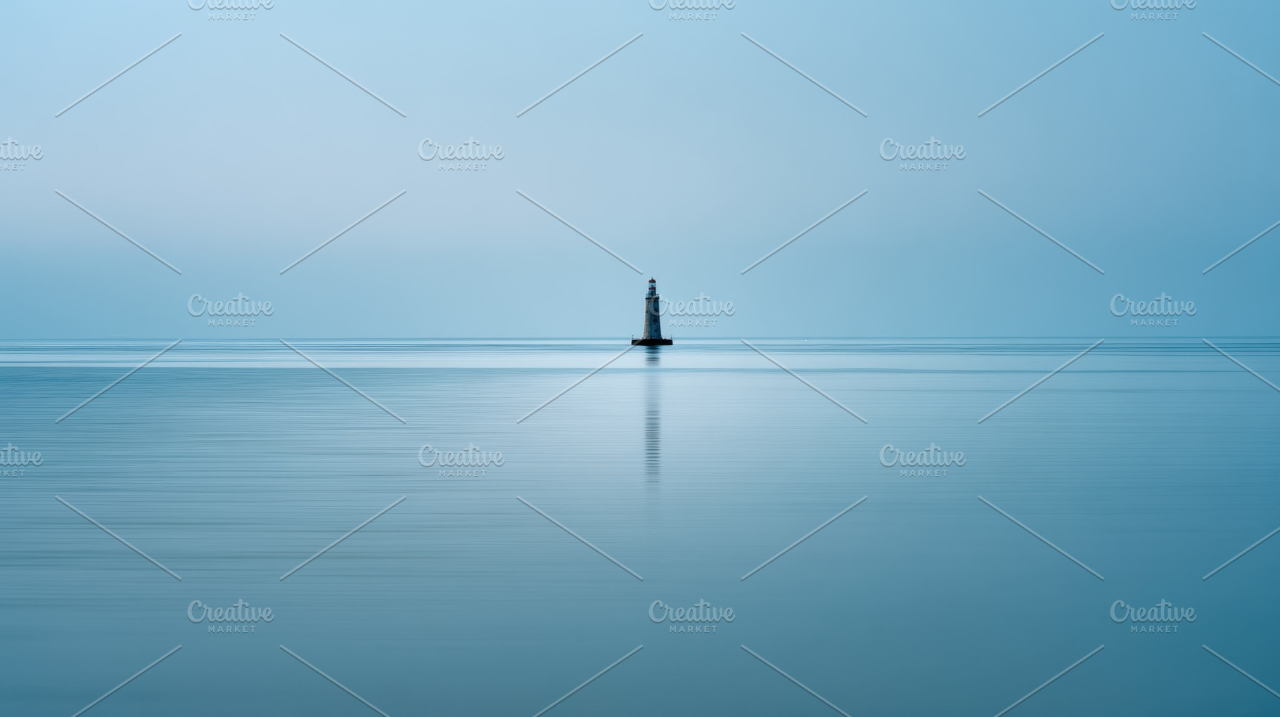 Lighthouse stands in calm waters, a Photo by Beautiful things
