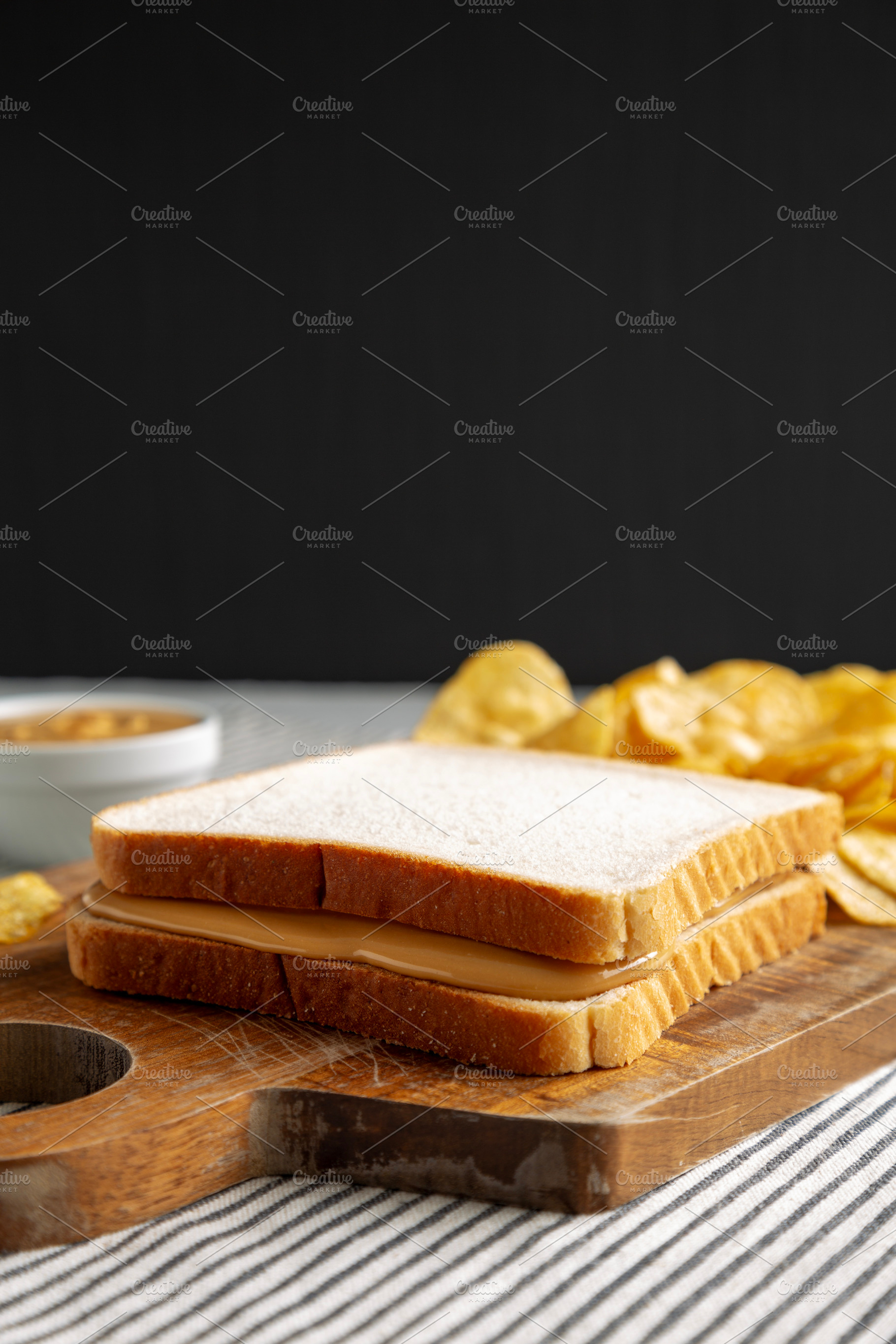 Homemade American Peanut Butter Sandwich on a Wooden Board, side, a Food & Drink Photo by LiudmylaChuhunova