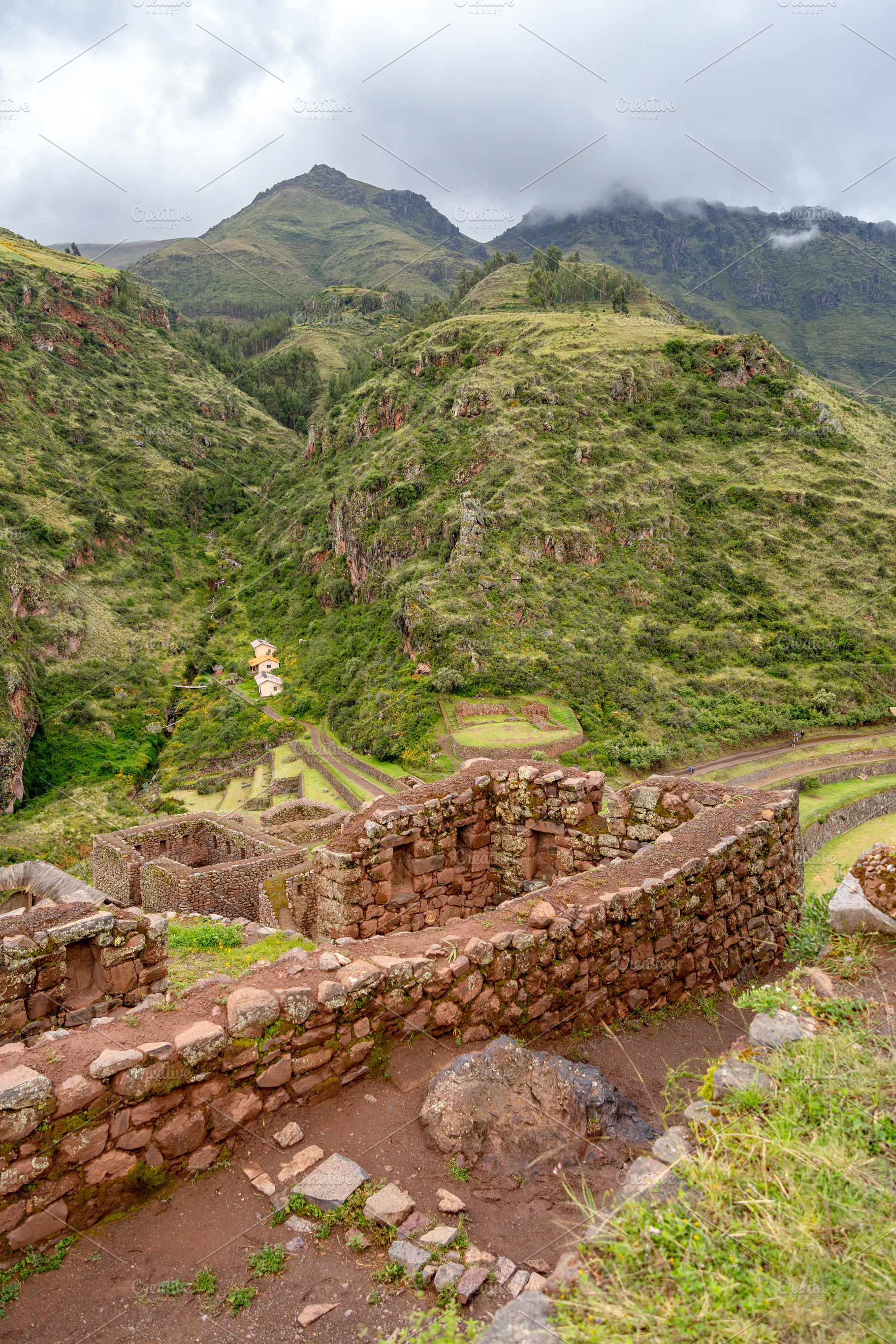 Ancient Inca ruins of Pisac nestled in the Andean mountains, Per, a Photo by GoodGoods