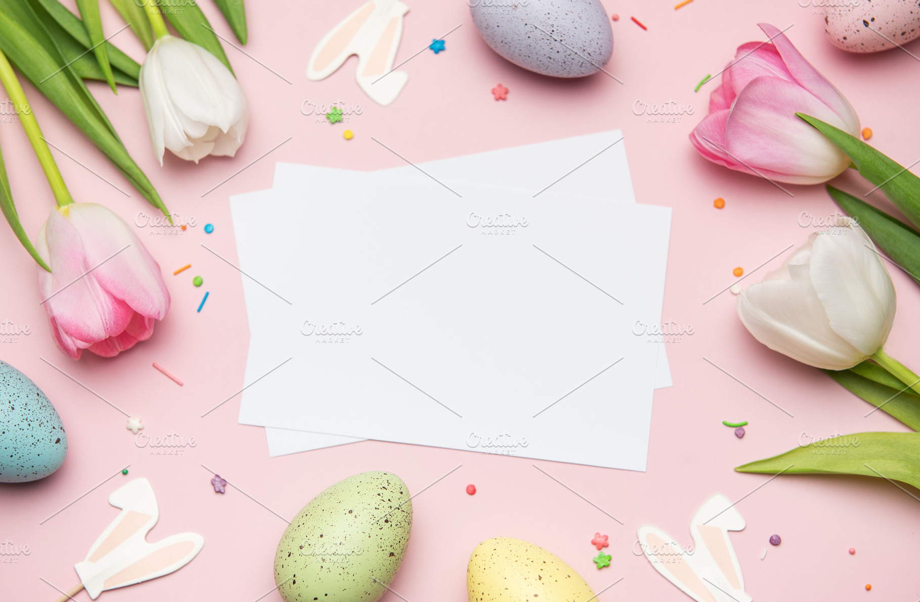Easter greeting card mockup with colorful eggs and tulips on pin, a Holiday Photo by Olena Rudo