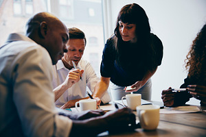 Businesspeople working together in an office, a Business Photo by Stefan & Janni