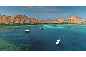Tour boats sailing Komodo National, a Nature Photo by Goinyk