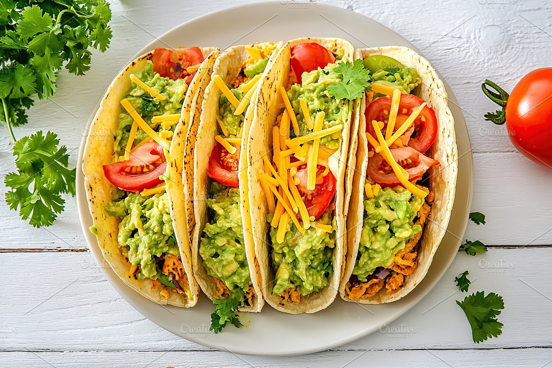 Vegetarian tacos with guacamole, cheese and tomatoes on a plate, a Food & Drink Photo by AlyaAnd