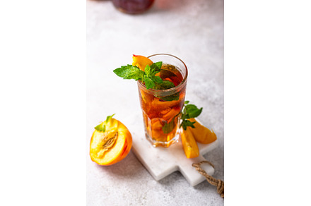 Cold ice tea with peach and mint, a Food & Drink Photo by Yulia Furman