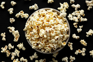 Homemade Butter Popcorn with Salt in a Bowl, top view., a Food & Drink Photo by LiudmylaChuhunova