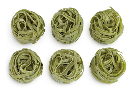Raw tagliatelle green pasta with, a Food & Drink Photo by NataPhoto