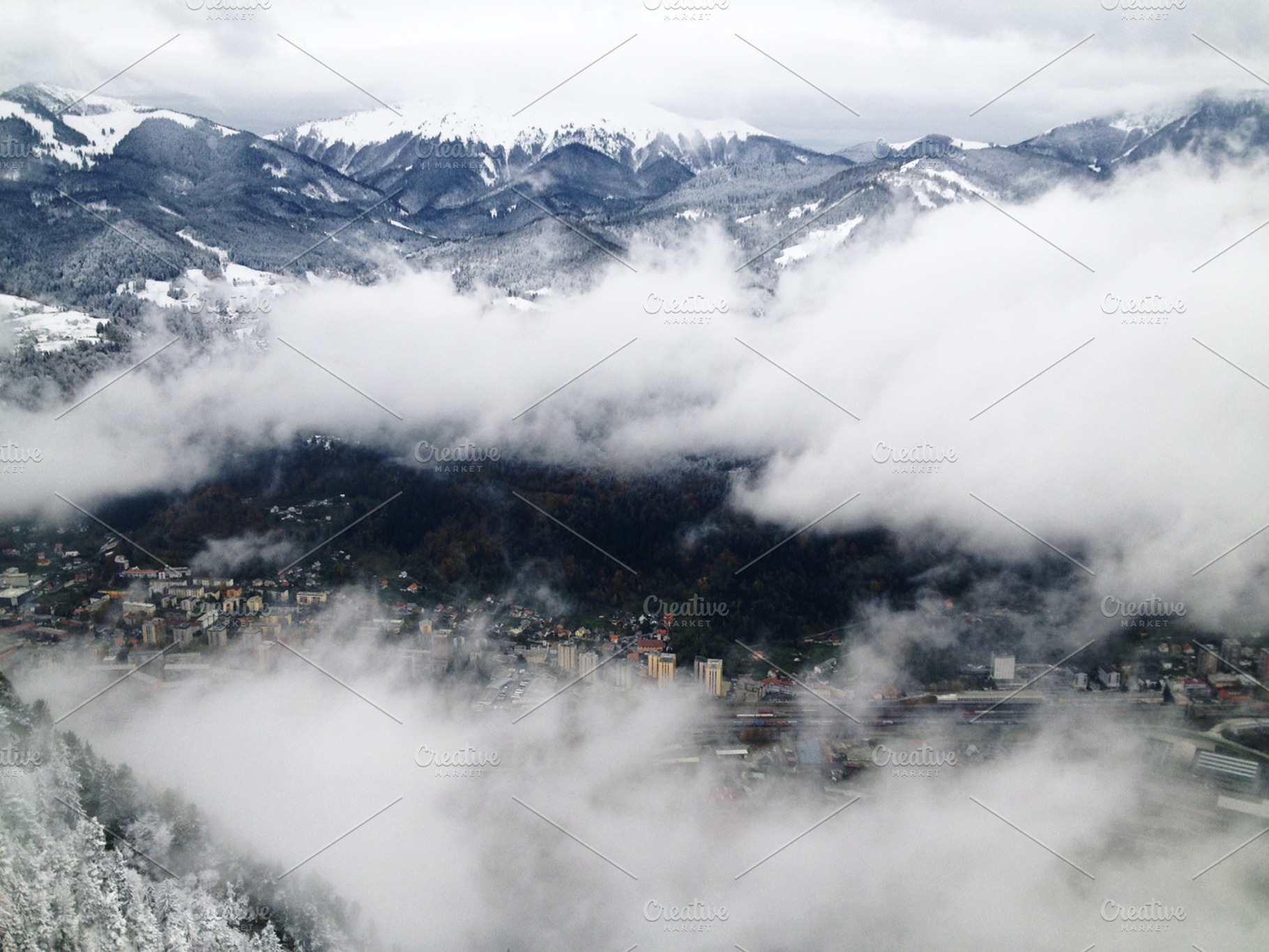 Town Caught In Snow And Fog