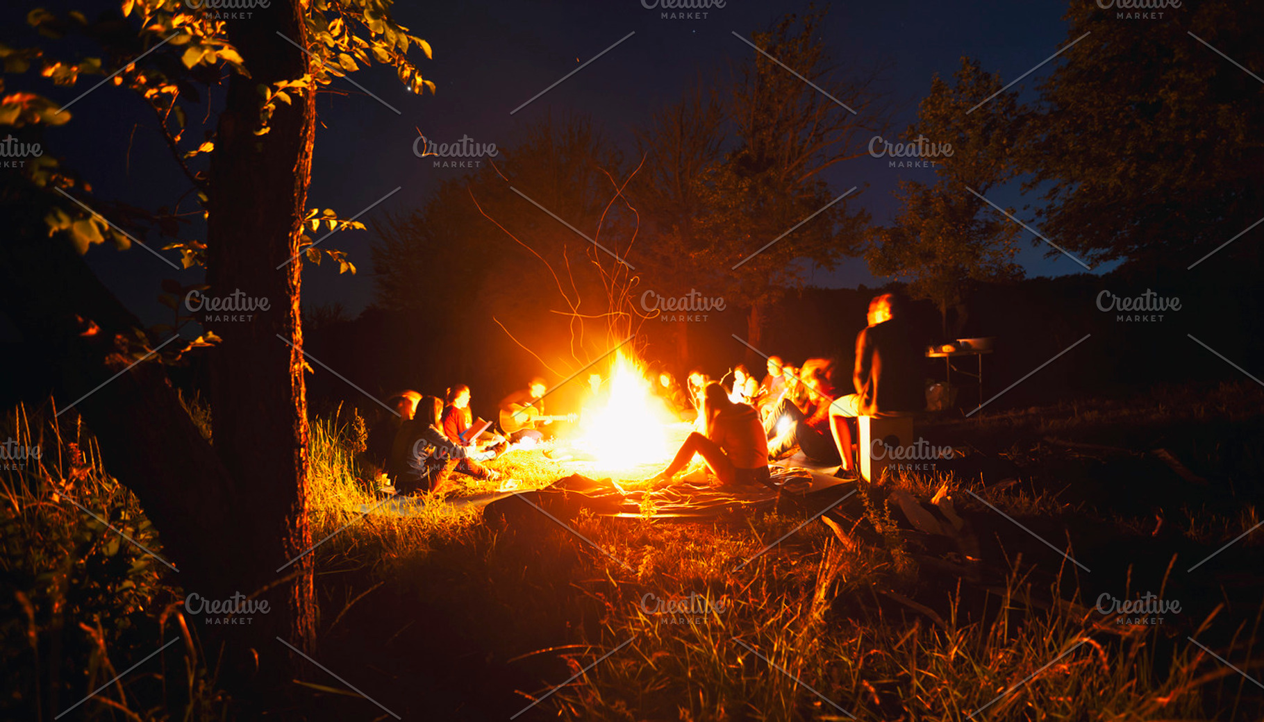 People sitting around the bonfire, a Background Photo by Olegkalina