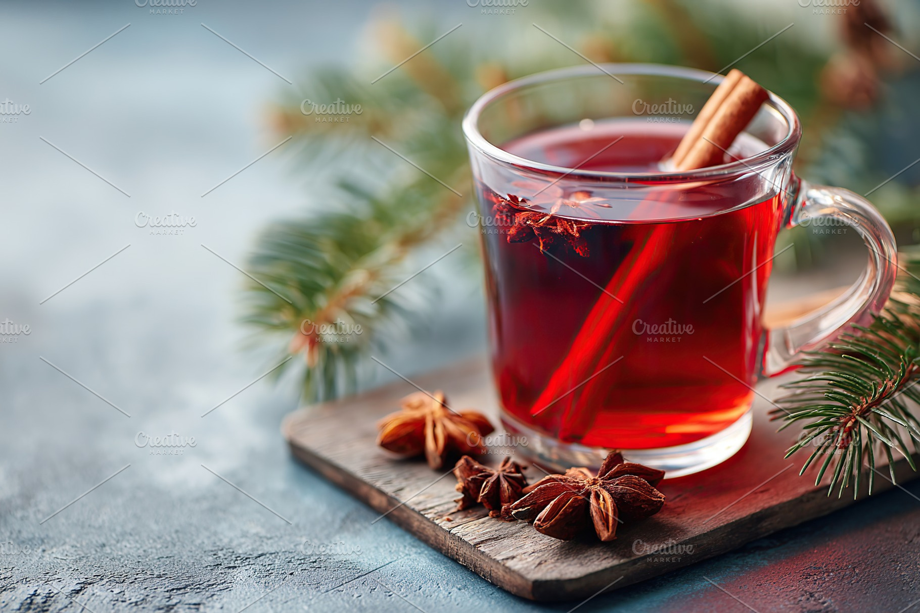 Warm spiced drink in a glass cup with cinnamon and star anise on a wooden board, a Food & Drink Photo by AlyaAnd
