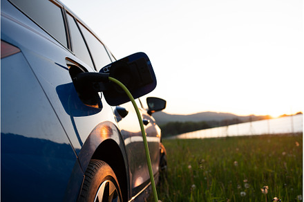 Close up of electric car charging, a Transportation Photo by HalfPoint