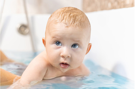 Baby after bathing in the bathroom, a Person Photo by yanadjana