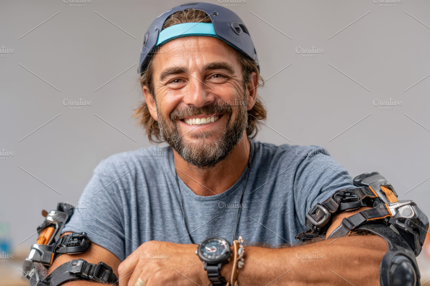Smiling man in protective gear enjoying outdoor activity, a Person Photo by AlyaAnd