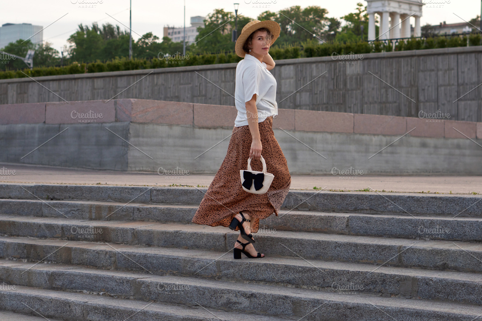 Fashionable woman walks up steps, a Person Photo by Elena Vagengeim