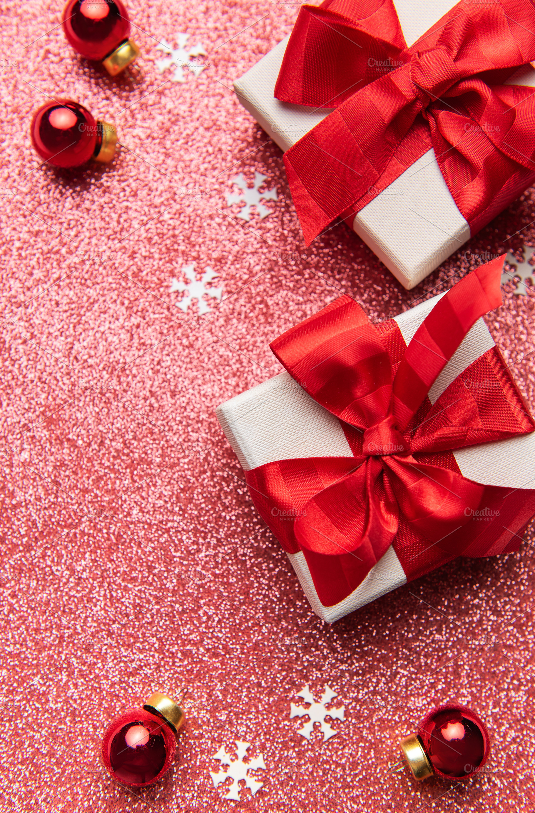 Christmas gifts decorating a red glitter background, a Holiday Photo by Olena Rudo