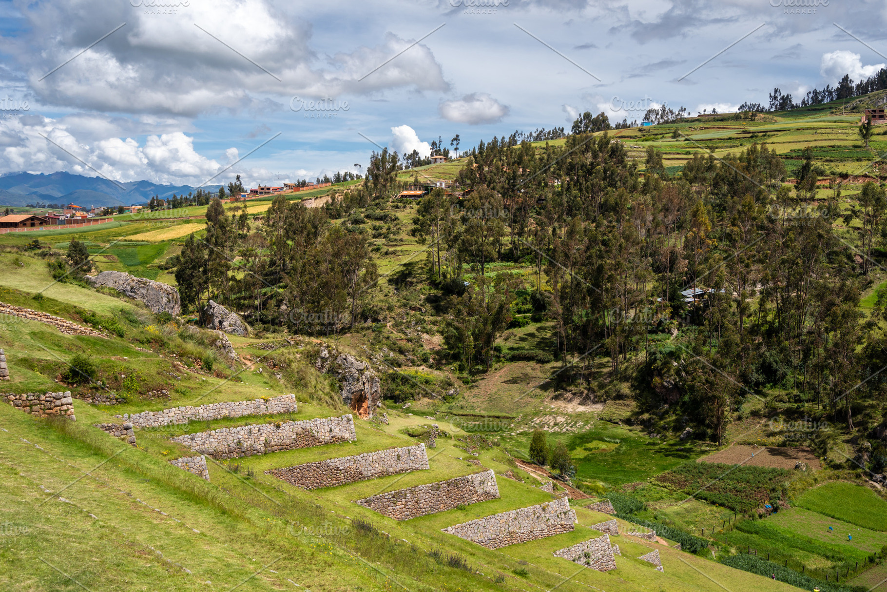 Inca archaeological site of Chinchero with terraces and mountain, an Architecture Photo by GoodGoods