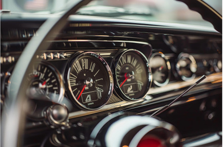 Close up of a classic car dashboard, a Transportation Photo by Ylivdesign