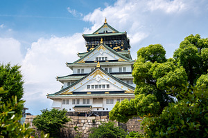 Main tower of Osaka Castle in Japan on sunny day, an Architecture Photo by GoodGoods