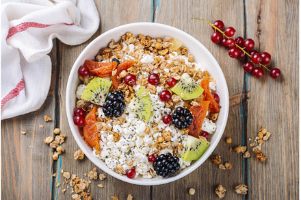 Cottage cheese with granola, berries, a Food & Drink Photo by Ekaterina_Markelova