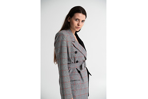 Young brunette woman posing in a, a Business Photo by volodymyrshtun13795