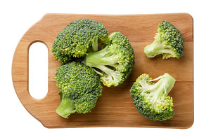 Broccoli on a kitchen board on a, a Food & Drink Photo by innakreativ