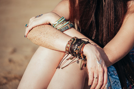Close up hands with boho accessories featuring jewelry, bohemian, and boho